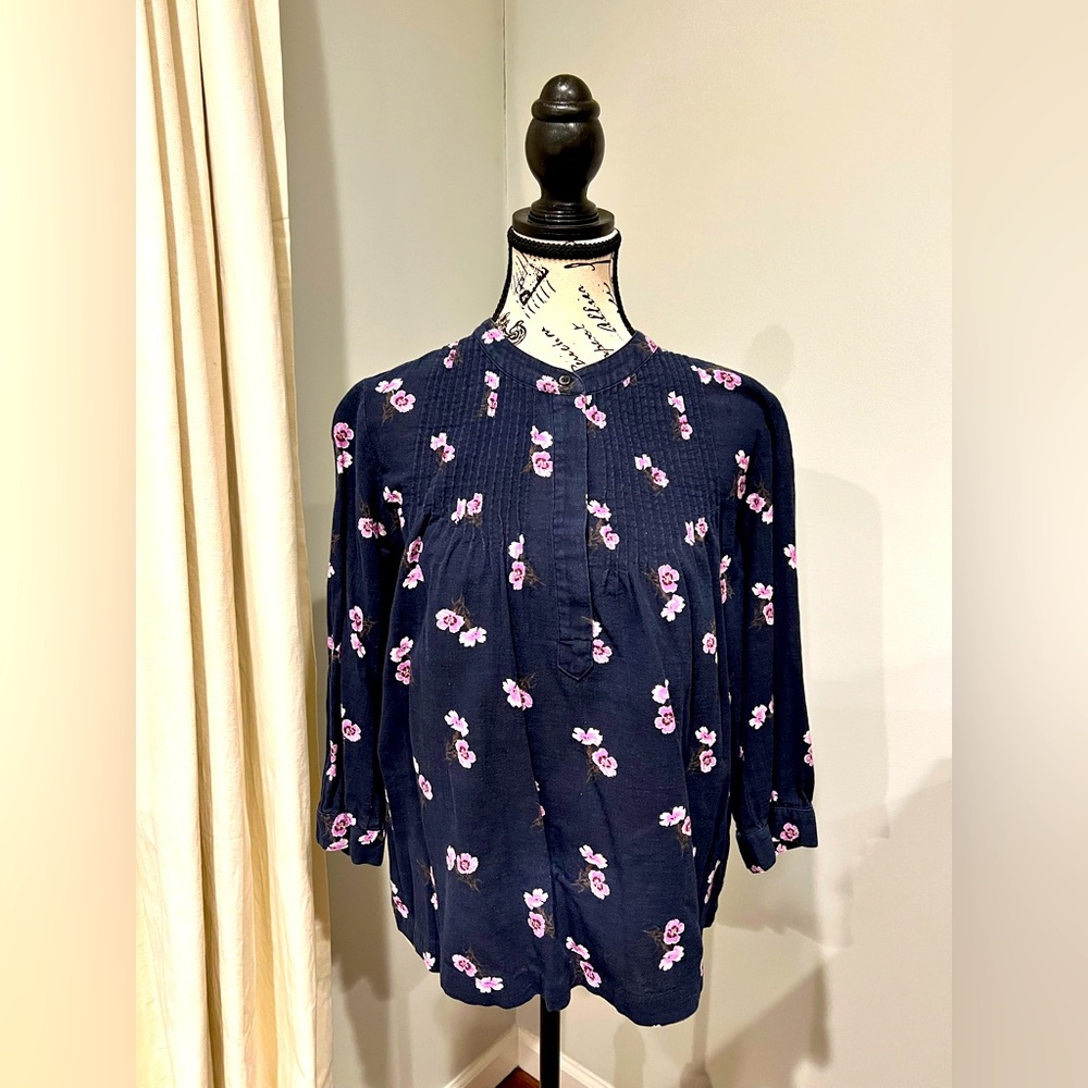 Blouse from Maxwell in a rich purple color with flower detail.